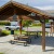 seating outside under wooden cabanas