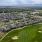 aerial showing property, connected amenities and local area